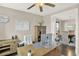 Home office with built-in wooden desk and large window at 11979 S Allerton Cir, Parker, CO 80138