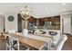 Spacious kitchen featuring granite countertops and dark wood cabinets at 11979 S Allerton Cir, Parker, CO 80138