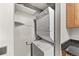 Stackable washer and dryer in a dedicated laundry closet at 8653 E Dry Creek Rd # 1126, Englewood, CO 80112