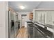 Updated kitchen, featuring stainless steel appliances and granite countertops at 8653 E Dry Creek Rd # 1126, Englewood, CO 80112