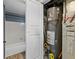 Water heater closet with accessible water heater at 8653 E Dry Creek Rd # 1126, Englewood, CO 80112