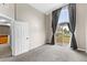 Bright bedroom with a balcony and large window at 8653 E Dry Creek Rd # 1126, Englewood, CO 80112