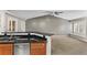 Kitchen with granite countertops and view into living room at 8653 E Dry Creek Rd # 1126, Englewood, CO 80112