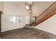 Bright and spacious entryway with wooden staircase at 22264 E Frost Pl, Aurora, CO 80016