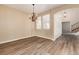 Formal dining room features a chandelier and hardwood floors at 22264 E Frost Pl, Aurora, CO 80016