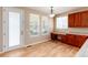 Bright kitchen nook with built-in workspace and backyard access at 22264 E Frost Pl, Aurora, CO 80016