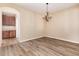 Dining room with hardwood floors and access to kitchen at 22264 E Frost Pl, Aurora, CO 80016