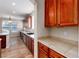 Kitchen with wood cabinets and tile countertops at 22264 E Frost Pl, Aurora, CO 80016