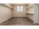 Large walk-in closet with plenty of shelving at 22264 E Frost Pl, Aurora, CO 80016