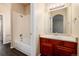 Full bathroom with tub, vanity, and mirror at 22264 E Frost Pl, Aurora, CO 80016