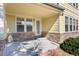 Inviting patio with stonework and entrance to the home at 22264 E Frost Pl, Aurora, CO 80016