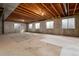 Unfinished basement with high ceilings and multiple windows at 22264 E Frost Pl, Aurora, CO 80016