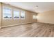 Bright bedroom with hardwood floors and multiple windows at 22264 E Frost Pl, Aurora, CO 80016
