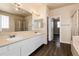 Bathroom with double vanity, shower, and bathtub at 22264 E Frost Pl, Aurora, CO 80016
