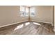 Well-lit bedroom with hardwood floors and window at 22264 E Frost Pl, Aurora, CO 80016