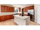 Well-equipped kitchen with island and stainless steel appliances at 22264 E Frost Pl, Aurora, CO 80016