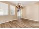 Bright dining room with hardwood floors and chandelier at 22264 E Frost Pl, Aurora, CO 80016