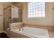 Bathroom with a shower and a large soaking tub at 22264 E Frost Pl, Aurora, CO 80016