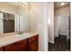 Bathroom with vanity, sink, and access to another bathroom at 22264 E Frost Pl, Aurora, CO 80016