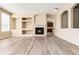Living room featuring a fireplace and built-in shelving at 22264 E Frost Pl, Aurora, CO 80016