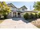 Two-story yellow house with a large front yard at 22264 E Frost Pl, Aurora, CO 80016