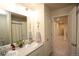 Double vanity bathroom with updated fixtures and linen closet at 1908 Homestead Dr, Fort Lupton, CO 80621