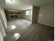 Spacious basement with a fireplace and carpeted floors at 17337 E Flora Pl, Aurora, CO 80013