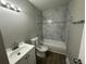 Updated bathroom with marble tile and new vanity at 17337 E Flora Pl, Aurora, CO 80013