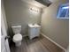 Basement bathroom with toilet and sink vanity at 17337 E Flora Pl, Aurora, CO 80013