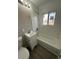 Updated bathroom with a bathtub, sink, and toilet at 17337 E Flora Pl, Aurora, CO 80013