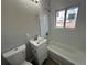 Updated bathroom with a bathtub, sink, and toilet at 17337 E Flora Pl, Aurora, CO 80013