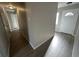 Bright hallway with laminate wood floor and doors to other rooms at 17337 E Flora Pl, Aurora, CO 80013
