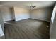 Spacious living room with laminate wood floors and ceiling fan at 17337 E Flora Pl, Aurora, CO 80013