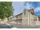 Tan siding building with multiple garage doors at 7370 E Florida Ave # 1020, Denver, CO 80231