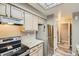 Galley kitchen with granite countertops and stainless steel appliances at 7370 E Florida Ave # 1020, Denver, CO 80231