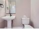 Simple bathroom with pedestal sink and toilet at 2584 W 69Th Pl, Denver, CO 80221