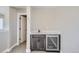 Modern wet bar with dark cabinetry and a beverage fridge at 2584 W 69Th Pl, Denver, CO 80221