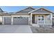 Two-story craftsman style home with attached garage and front porch at 1278 Raindance Pl, Erie, CO 80516