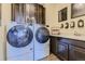 Convenient laundry room with Whirlpool washer and dryer at 13715 Emerald Lake St, Parker, CO 80138