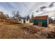 Two storage sheds in a large backyard at 2415 E Maplewood Ave, Centennial, CO 80121