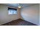 Bright bedroom with ceiling fan and window at 2415 E Maplewood Ave, Centennial, CO 80121