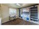 Home office with built-in shelves, desk, and chair at 2415 E Maplewood Ave, Centennial, CO 80121