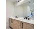 Modern bathroom with double vanity and marble countertops at 1701 S Newport Way, Denver, CO 80224