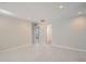 Bright hallway with tile floors and access to bedrooms and bathroom at 1701 S Newport Way, Denver, CO 80224