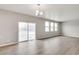 Open concept dining area with hardwood floors and sliding glass doors at 14104 Black Sedge Cir, Parker, CO 80134