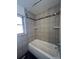 Bathroom with shower/tub combo and tile at 6601 E Exposition Ave, Denver, CO 80224