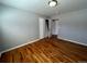 Well-lit bedroom with hardwood floors and closet at 6601 E Exposition Ave, Denver, CO 80224