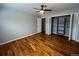 Bedroom with hardwood floors, ceiling fan and closet at 6601 E Exposition Ave, Denver, CO 80224