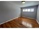 Spacious bedroom featuring hardwood floors and a window at 6601 E Exposition Ave, Denver, CO 80224