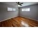 Bedroom with hardwood floors and window blinds at 6601 E Exposition Ave, Denver, CO 80224